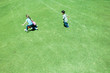 Children playing ball on grass