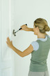 Woman removing nails with hammer