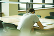 Male student studying, rear view