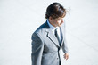 Businessman standing outdoors, waist up, high angle view