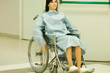 Female patient using wheelchair, blurred motion