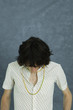 Teenage boy with head down, portrait
