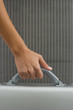 Woman carrying briefcase, cropped view of hand