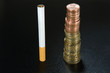Cigarette next to stack of coins, close-up