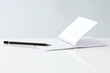 Open notebook and pencil, close-up