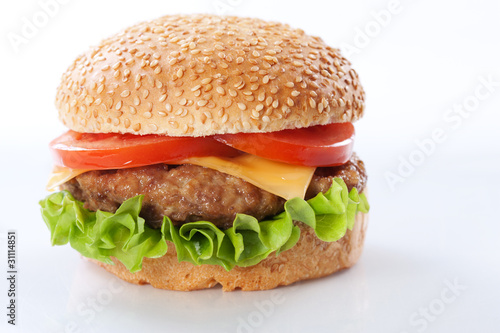 Photo: Cheeseburger with tomatoes and lettuce Cheeseburger with tomatoes and lettuce