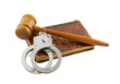 Photo: Judge's gavel and handcuffs on old legal book isolated Judge's gavel and handcuffs on old legal book isolated