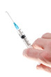 Syringe with medication in hand. Isolated on white.