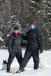 young man and woman in snowshoes young man and woman in snowshoes