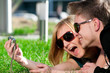 Photo: Emotional teenage couple photographing outdoor Emotional teenage couple photographing outdoor