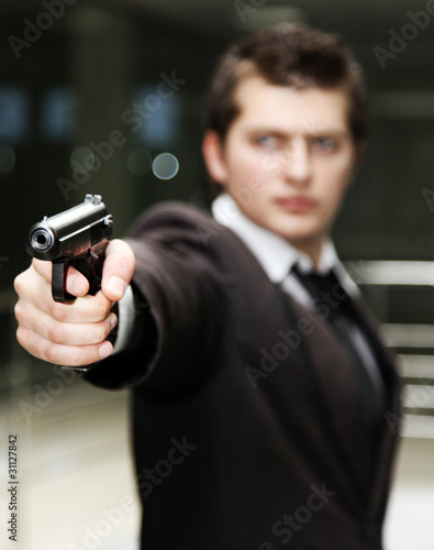 Photo: Businessman with gun Businessman with gun