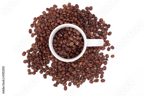 Photo: coffee beans in a cup on a white background coffee beans in a cup on a white background