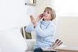 Mature woman looking at photos