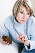 Pensive Woman Taking Pills