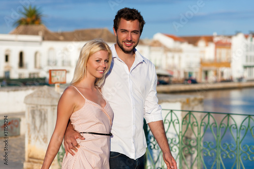 Photo: City tourism - couple in vacation on bridge City tourism - couple in vacation on bridge