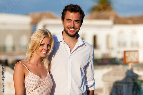 Photo: City tourism - couple in vacation on bridge City tourism - couple in vacation on bridge