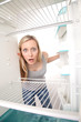 Teenager and empty fridge