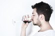 Young man drinking wine