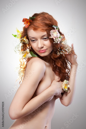 Photo: Portrait of beautiful woman with spring flowers Portrait of beautiful woman with spring flowers