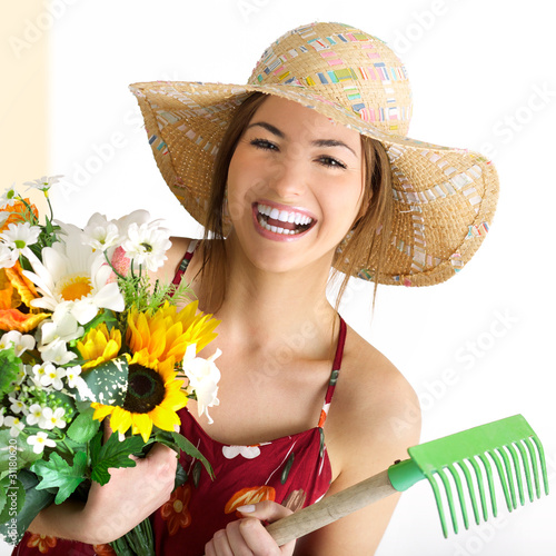 Photo: model girl portrait with plant and tools model girl portrait with plant and tools