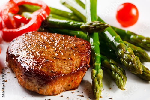 Photo: Grilled steaks and asparagus Grilled steaks and asparagus