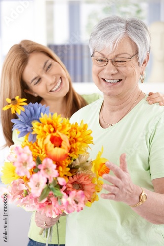 Photo: Elderly woman and daughter smiling happily Elderly woman and daughter smiling happily
