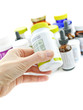 Hand holding medicine bottle Hand holding medicine bottle