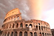 rain clouds above Colosseum at sunset