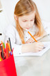 Photo: girl painting picture on table girl painting picture on table