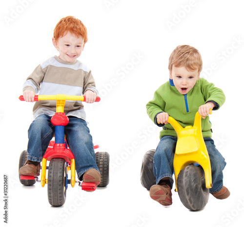 Photo: Children riding kids tricycles Children riding kids tricycles