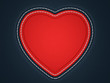 Red stitched heart shape on black leather