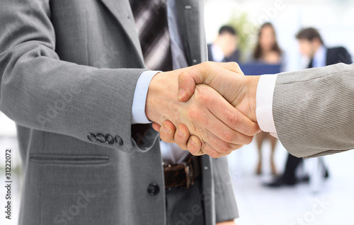 Photo: handshake isolated in office handshake isolated in office