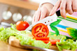 Woman's hands cutting vegetables