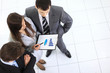 Above view of business partners hands over papers
