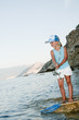 Little girl fishing  at the beach