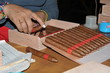 Putting cigars in exlusive tobacco box