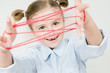 Creative mind - girl playing cats cradle game