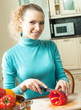 Woman cooking with vegetables, at home Woman cooking with vegetables, at home