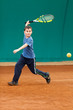 Boy playing tennis