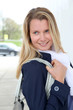 Portrait of beautiful blond woman in town
