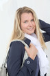 Portrait of beautiful blond woman in town
