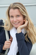 Portrait of beautiful blond woman in town