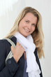 Portrait of beautiful blond woman in town
