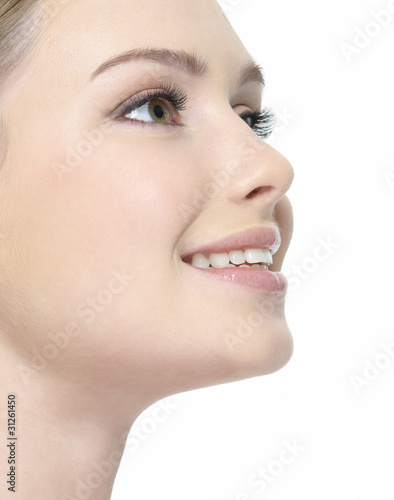 Photo: Closeup smiling face of woman Closeup smiling face of woman