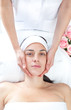 Beautiful women receiving a facial massage
