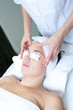 Close-up of a female receiving facial treatment