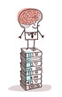 man with big brain on stack of books man with big brain on stack of books