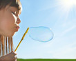 Blowing soap bubbles