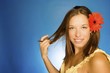 Brunette Model With Flower In Her Hair