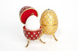Two jewels eggs with a real one